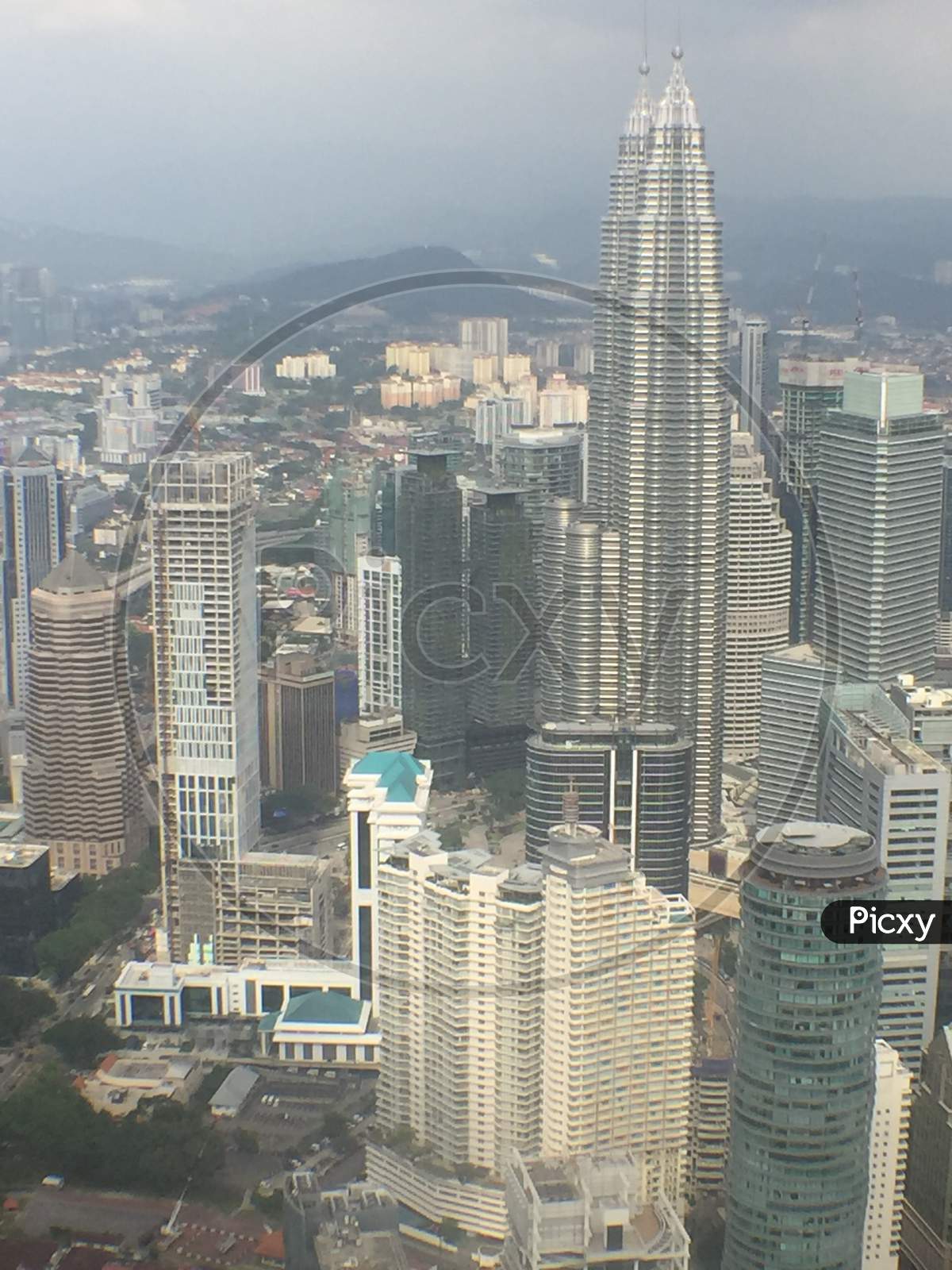 And Birdseye view of Malaysian city landscape and Kuala Lumpur twin towers from side