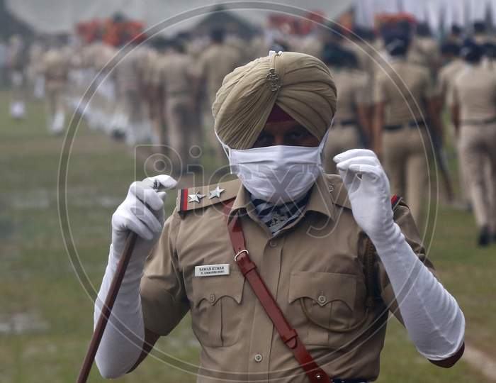 Policemen leave the parade ground after full dress rehearsal ahead of India's 74th  Independence day in Chandigarh August 13, 2020