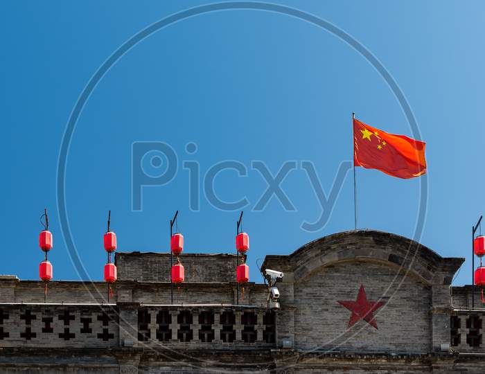 Chinese Flag On An Old Building In Beijing, China