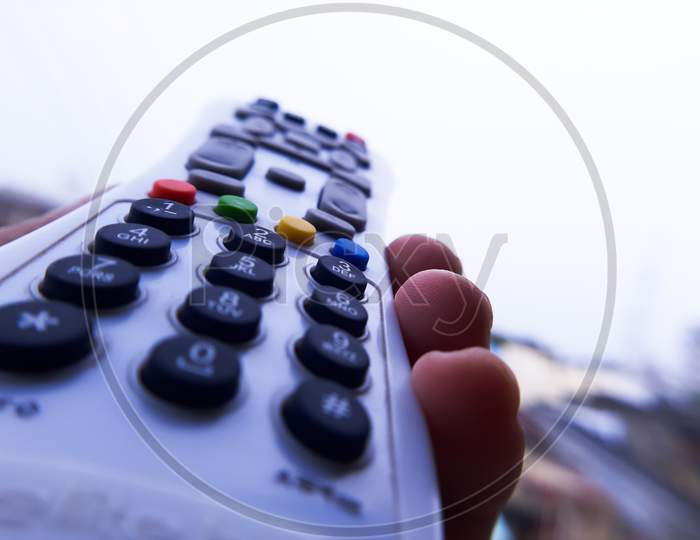 A remote control of a television clicked with macro lens