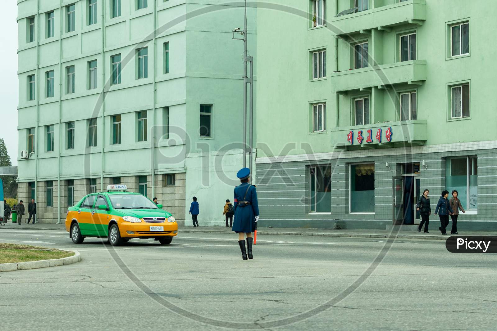 Female Traffic Police Officer Directing Traffic In Pyongyang, North Korea
