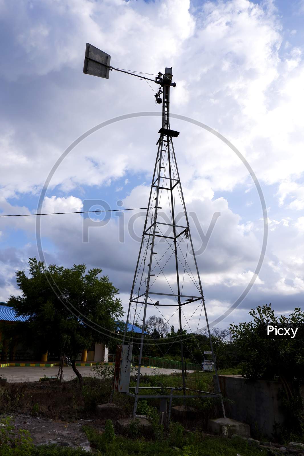 Long View Of Weather Vane Metal Tower Isolated In Outdoor