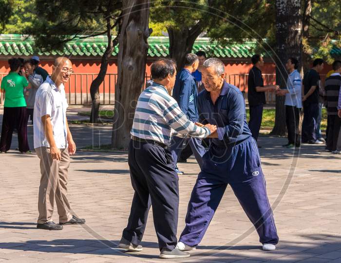 Elderly People Practicing Kung Fu In Tuanjiehu Park In Beijing, China