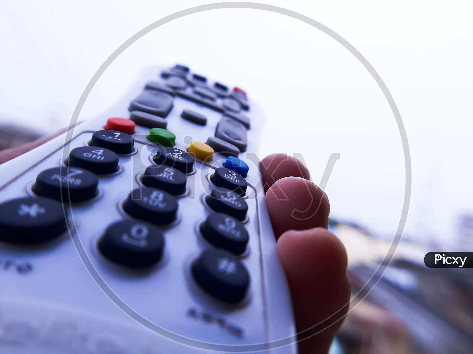 A remote control of a television clicked with macro lens