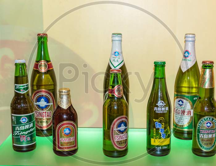 Different Packaging Of Tsingtao Beer Exhibited At Qingdao Beer Museum And Tsingtao Beer Brewery In Qingdao, China