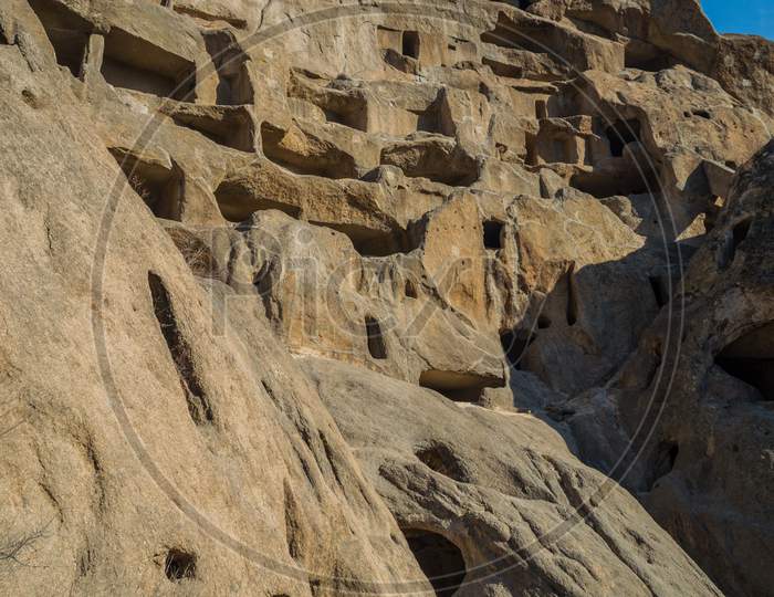 Ancient Cliff Dwellings Of Guyaju Caves In China