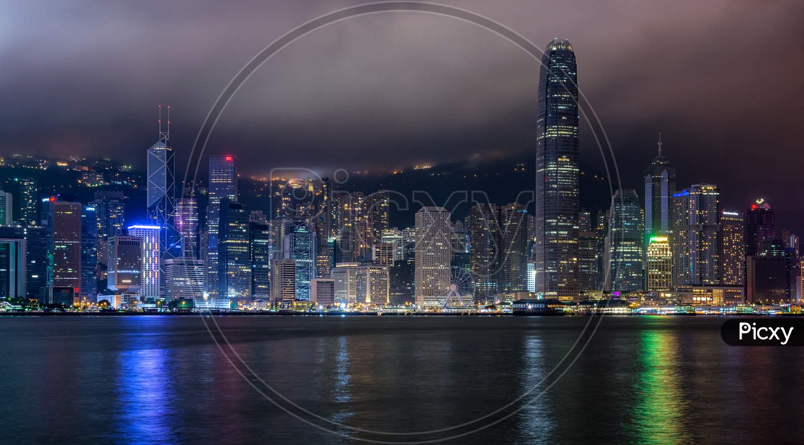 Panoramic Night View Of Hong Kong Skyline Across Victoria Bay