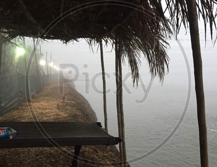 A small hut And a view of foggy and misty mornings in an aquaculture farm