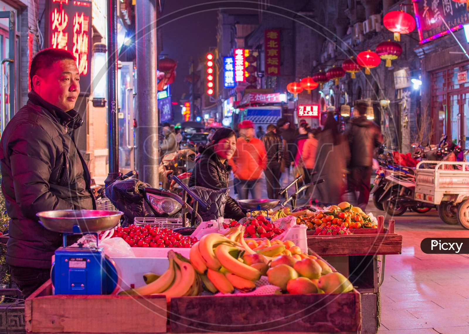 Street Vendors Selling Fruits In Old Qianmen Street In Beijing, China