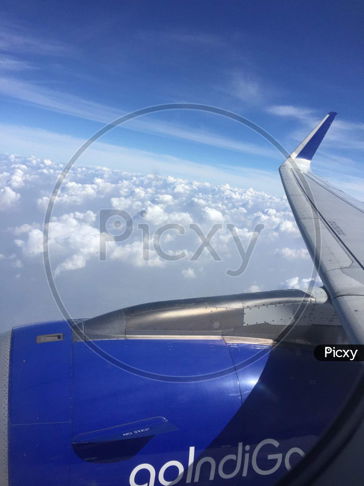 A view of sky and clouds from a plane window