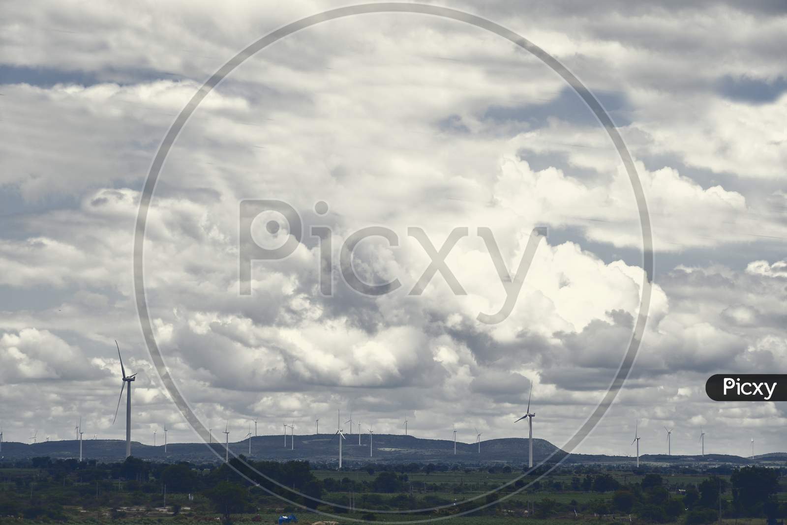 Wind Farm With Turbine, Clouds, Mountain Stock Images .