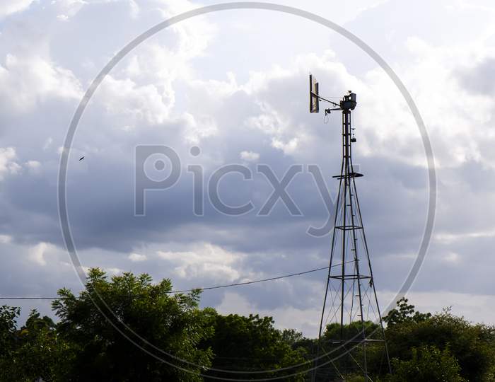 Weather Vane Tower Isolated In Nature