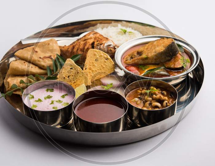 Indian Fish Platter Or Seafood Thali Served In A Steel Plate Or Over Banana Leaf