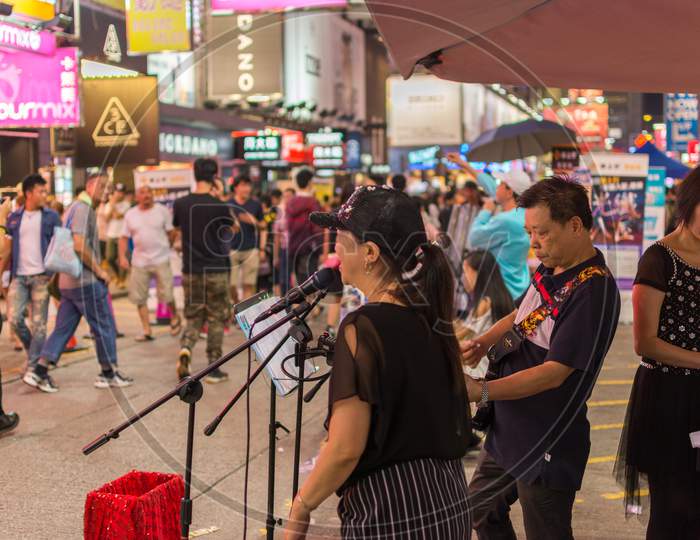 Street Musicians Performing In Kowloon, Hong Kong