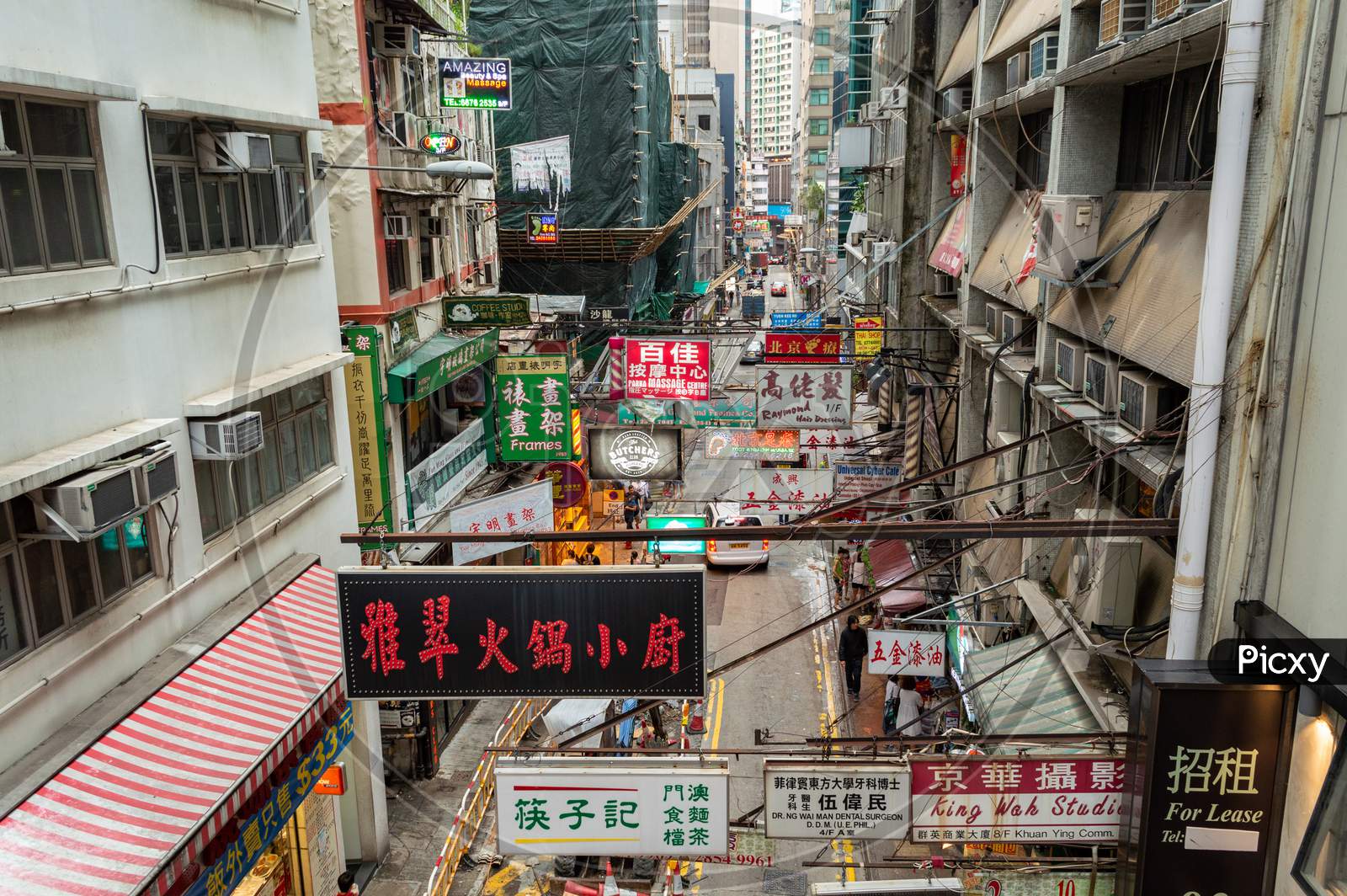 Neon Signs Advertising Stores In A Busy Street In Hong Kong