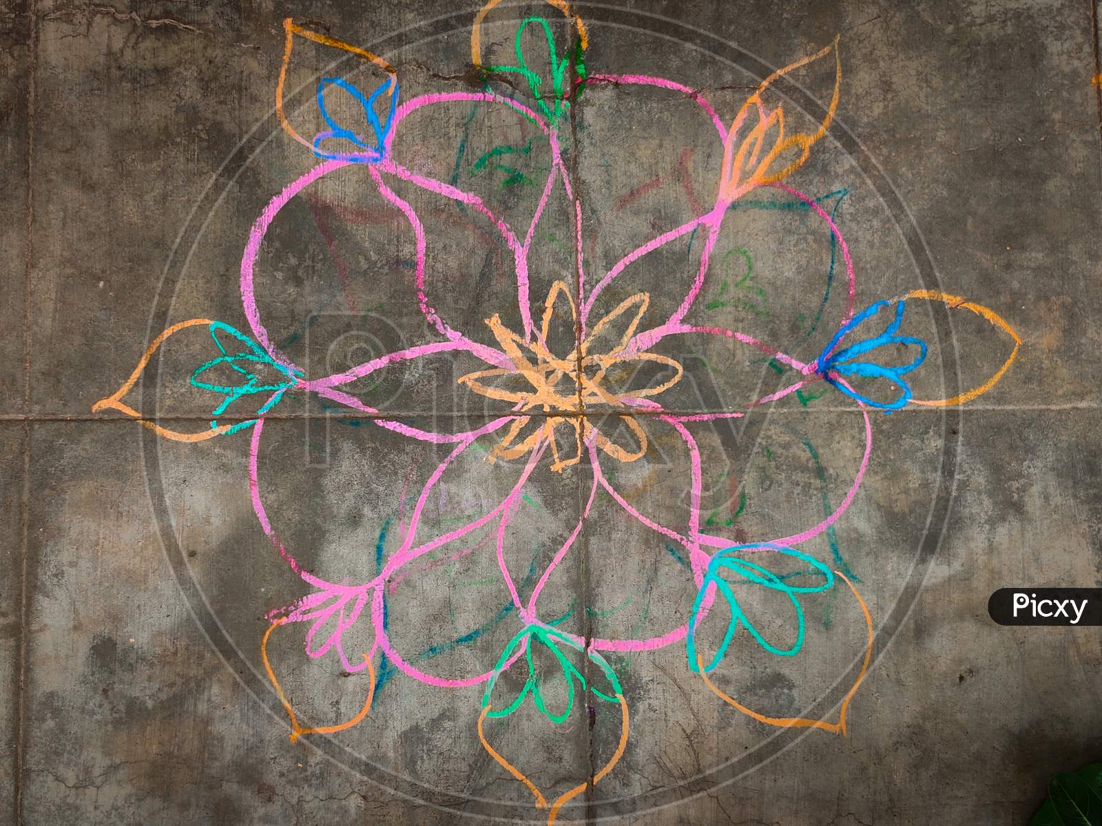 Colorful Flower Kolam Drawn Using Color Chalk Pieces. In Front Of South Indian Home. Festival Time Concept