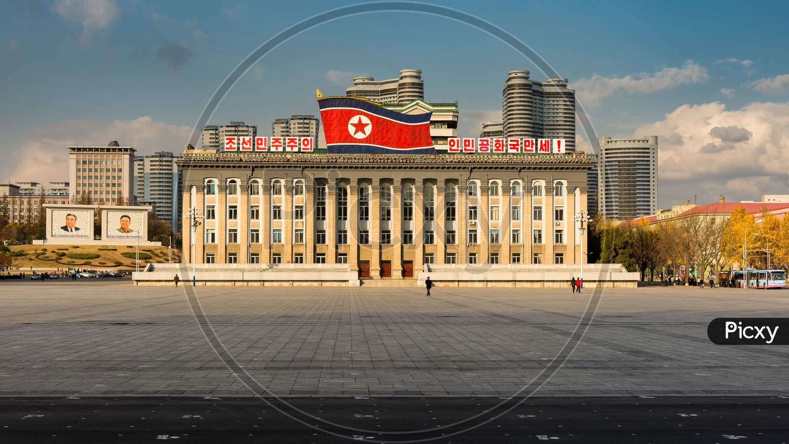 Kim Il-Sung Square And Government Building Decorated With Huge Flag Of North Korea