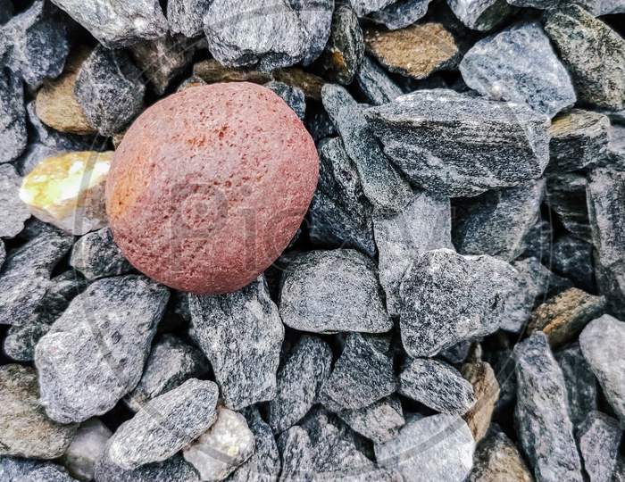 Selective Focus On A Red Stone Middle Of The Stones