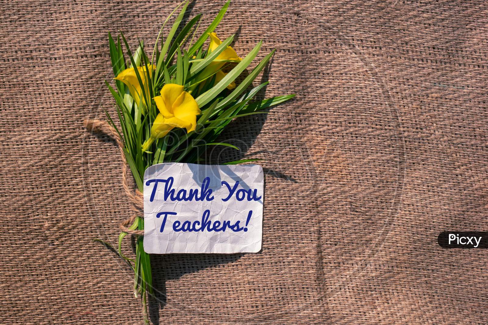 Thank You Teachers Note With Yellow Oleander Flowers On Burlap Fabric