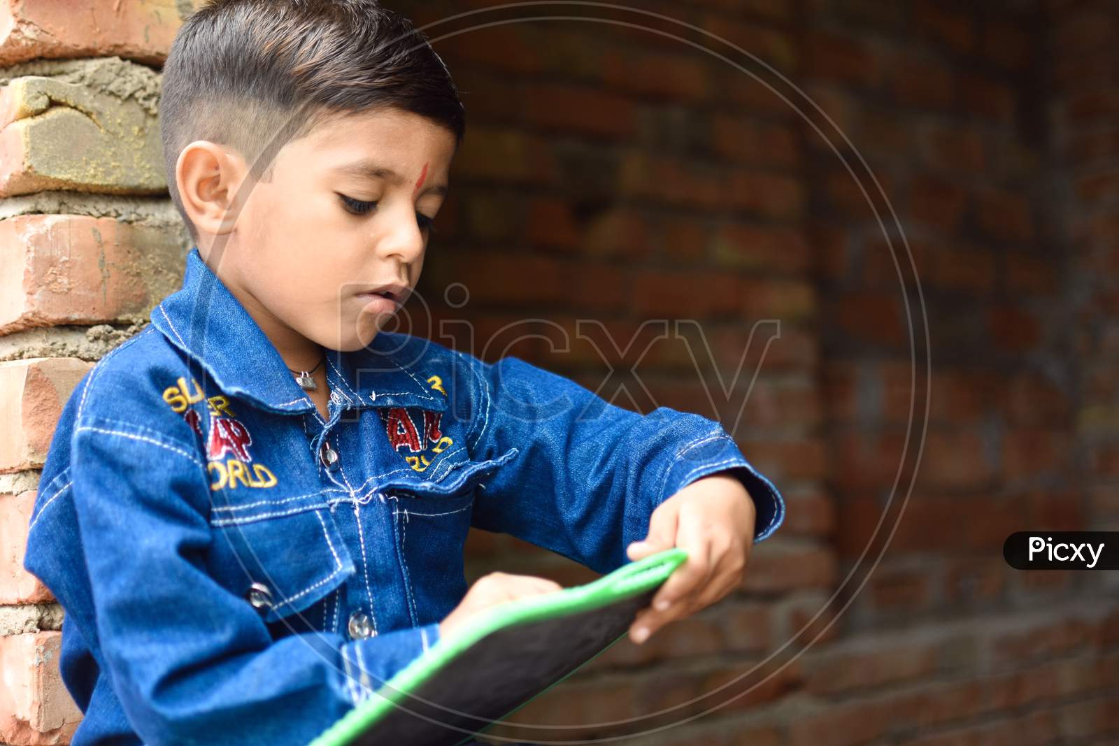 indian kid in primary school enjoying learning
