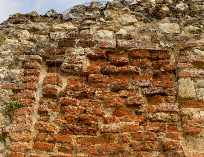 Gorgeous Textured Surface Of Ancient Ruins. Old English Bricks Weathered By The Centuries