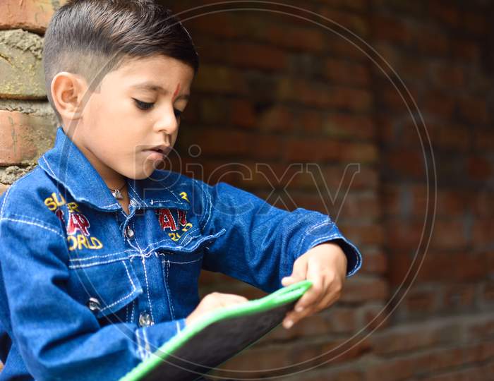 indian kid in primary school enjoying learning