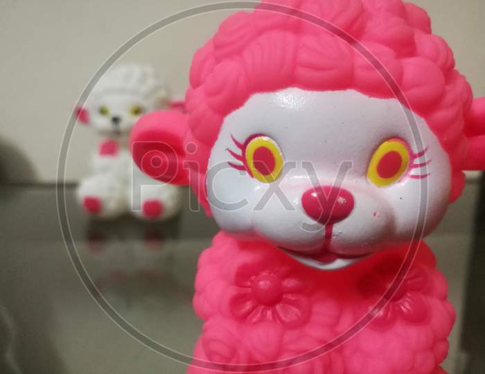 Closeup Shot Of A Sheep Doll With Red Color.