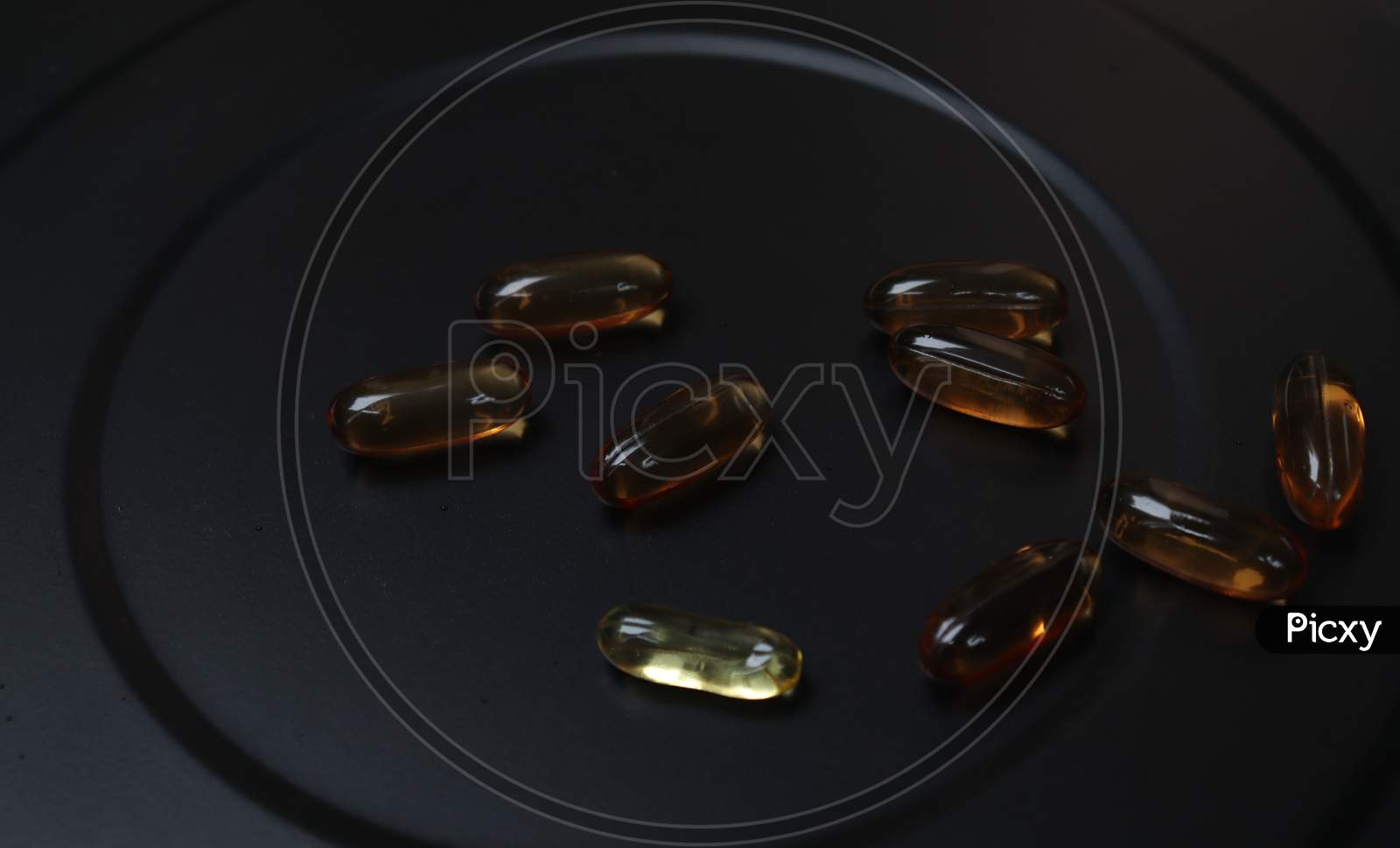 vitamin E capsule with dark background