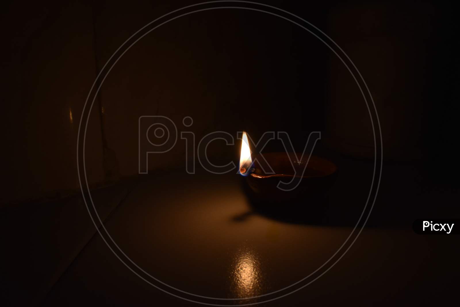 Earthen lamp(diya) burning in dark.
