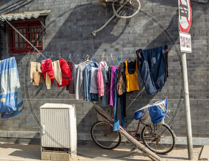 Laundry Hanging For Air Drying In A Small Hutong Alley In Beijing, China
