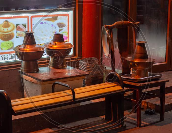 Hot Pots Cooling Off In Front Of The Restaurant In Old Qianmen Street In Beijing