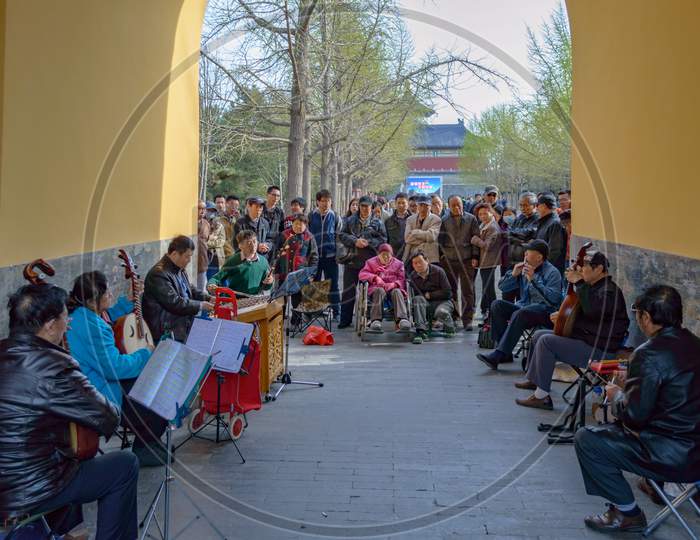 A Group Of Elder People Performs Traditional Chinese Music In Beijing, China