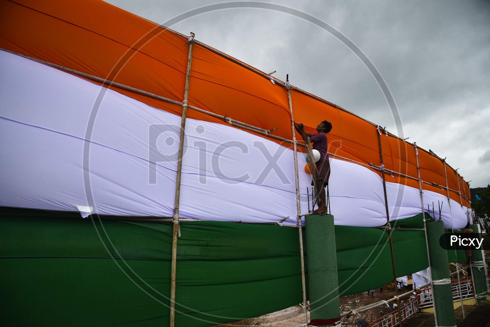 A worker make arrangements for the upcoming 74th Independence Day celebrations at Indira Gandhi Municipal Corporation Stadium, in Vijayawada, India, August 13, 2020.
