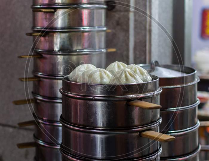 Steamed Pork And Vegetable Buns (Baozi) In Front Of A Restaurant In Beijing