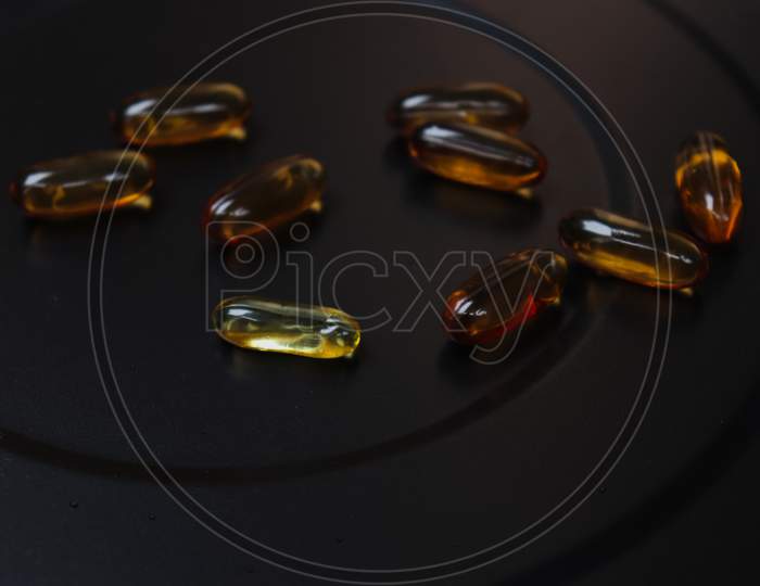 vitamin E capsule with dark background