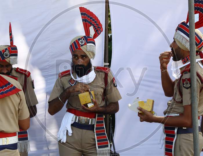 Policemen eat refreshment after taking part in India's 74th Independence Day celebrations In Chandigarh August 15, 2020