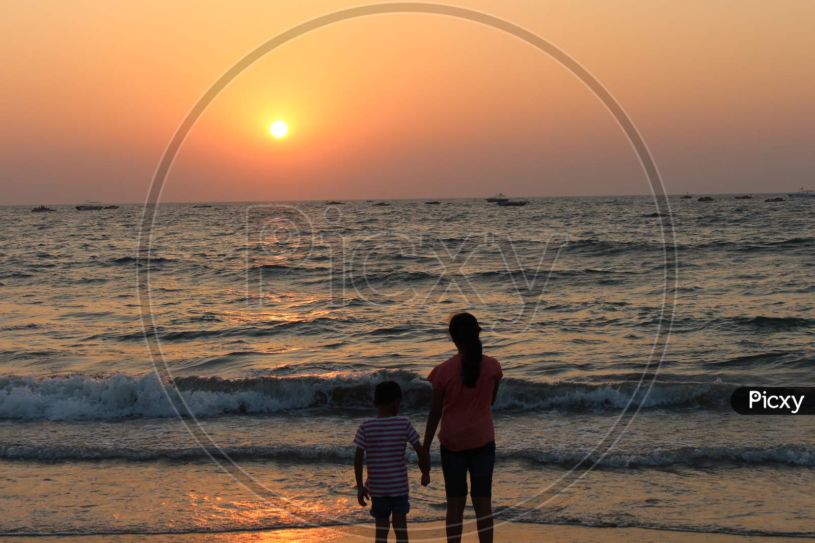children enjoying the sunset in beaches of Goa
