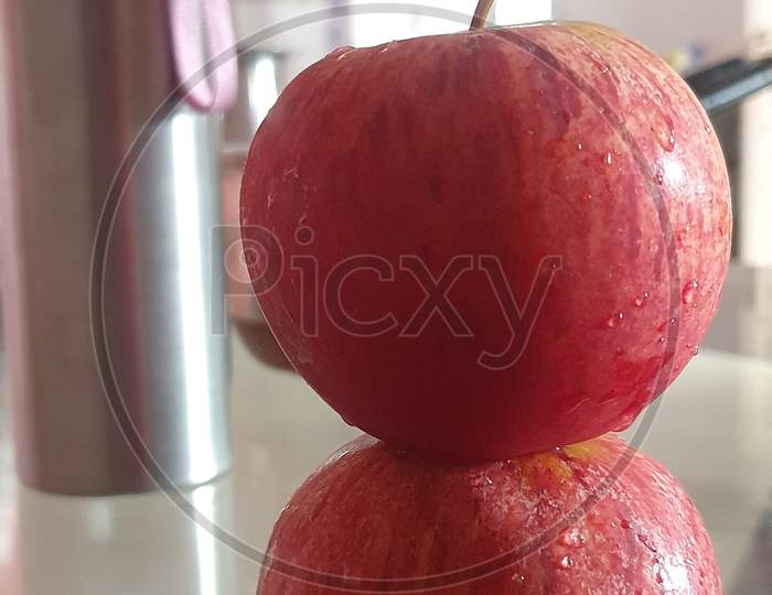Apple appear on another apple.