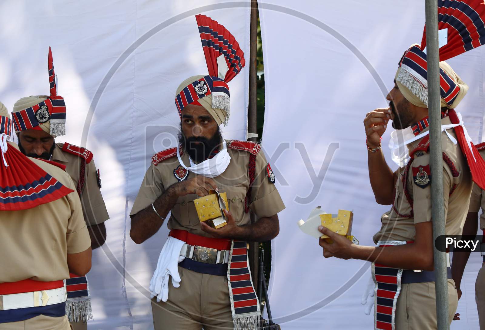 Policemen eat refreshment after taking part in India's 74th Independence Day celebrations In Chandigarh August 15, 2020