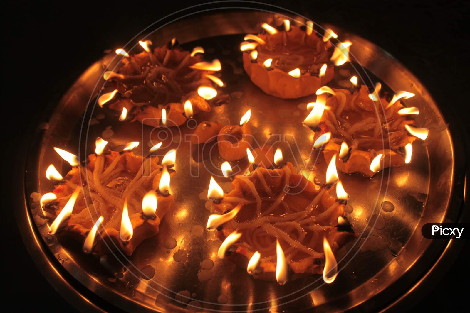 Holy Lamps For Religious Rituals In India Arranged In A Copper Plate