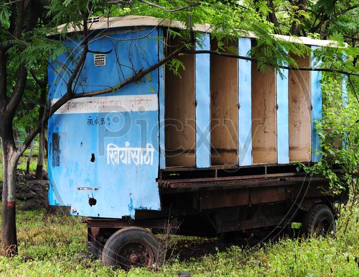 Abandoned mobile toilet for ladies parked on government land.
