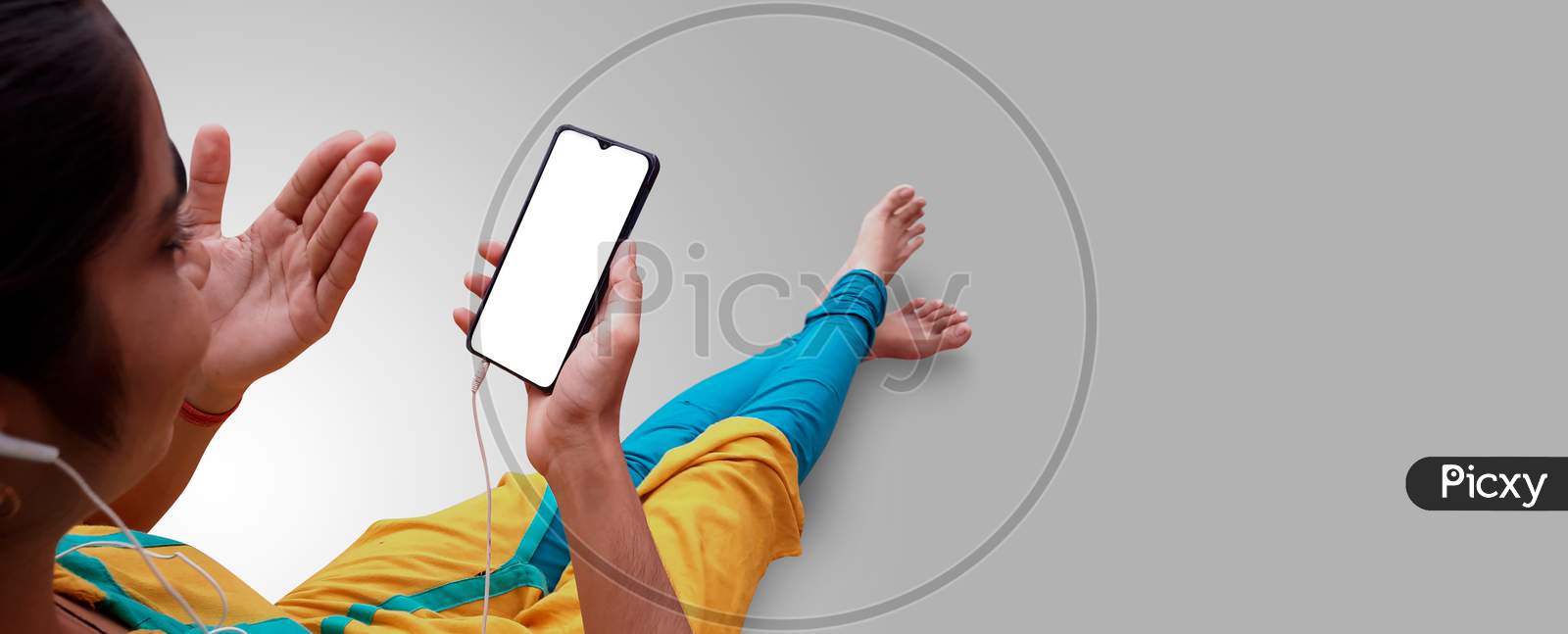 Girl Watching Mobile Phone With Hand Gestures And Wearing Earphone Mockup