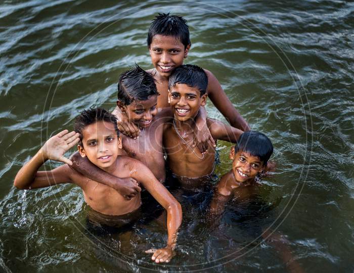 Carefree Playful kids in river kaveri.