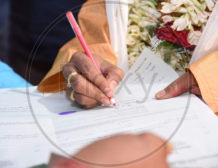 Groom Doing Signature On Marriage Register In India,