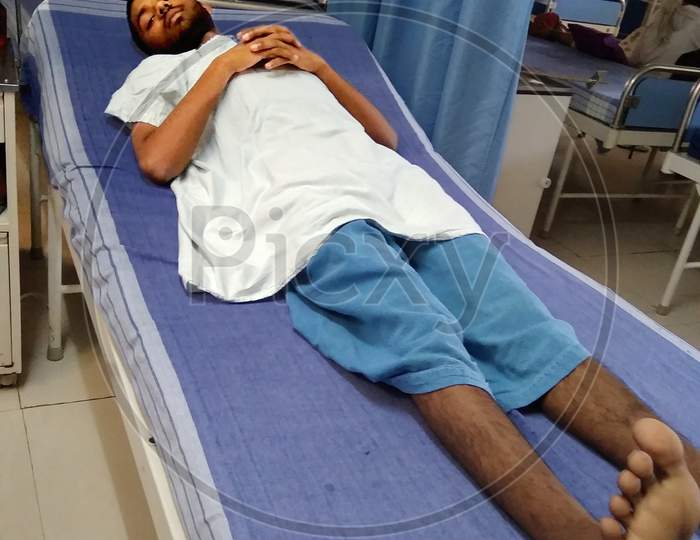 Patient laying on bed in hospital