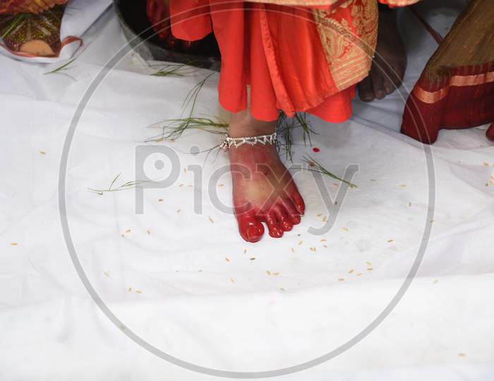 Bengali Bride'S Keeping First Foot On White Cloth At Husband'S House.