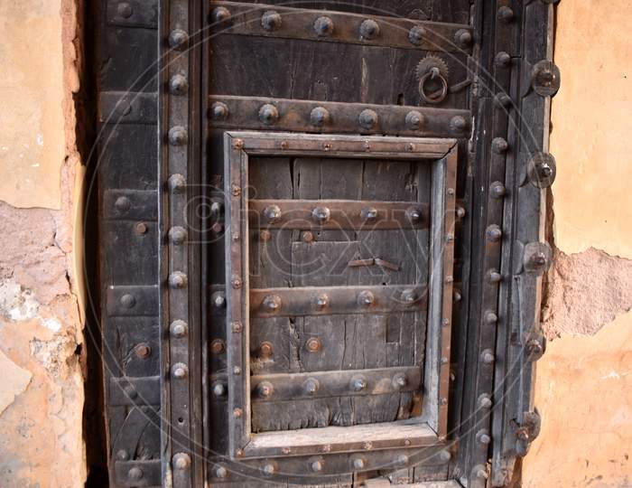 Close-up image of ancient India wooden door.
