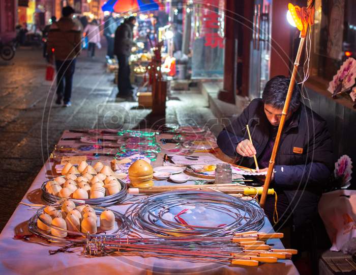 Man Making And Selling Traditional Handicrafts In Luoyang Old Town, Henan, China
