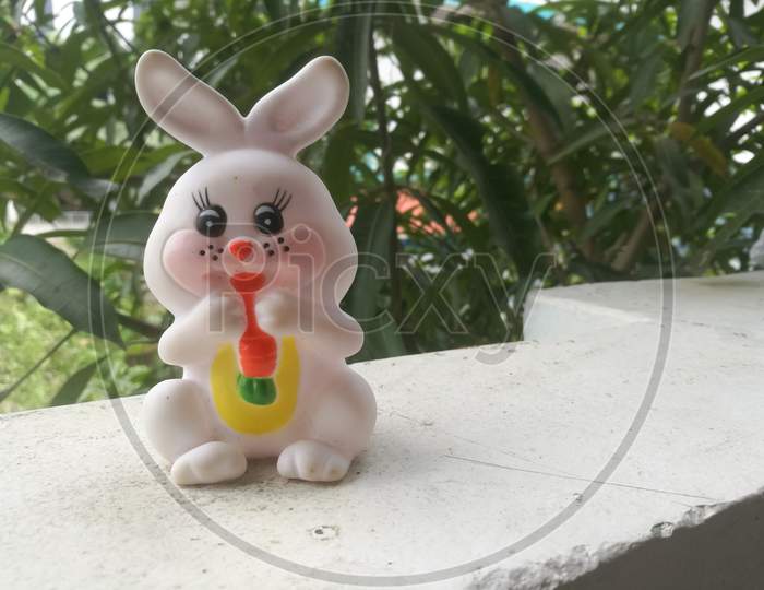 Toy Rabbit Of Small Size In White Color And Have Black Eyes.