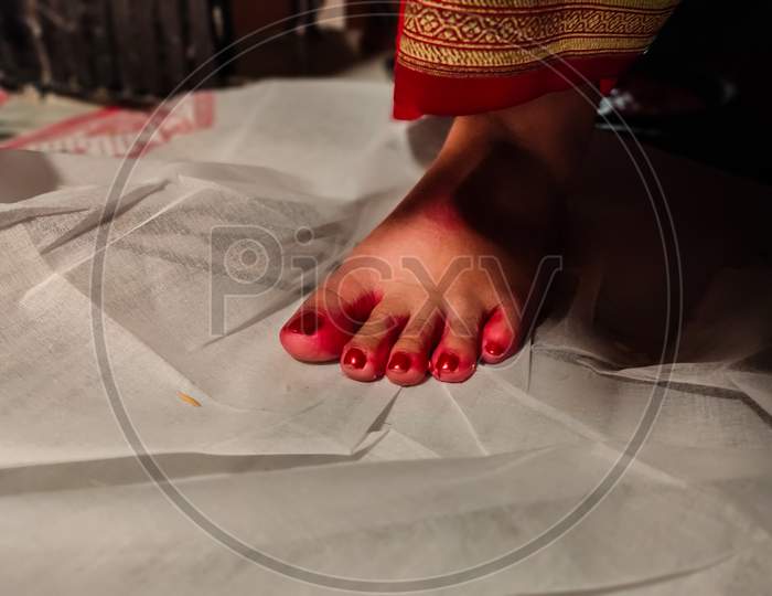 Bengali Bride'S Keeping First Foot On White Cloth At Husband'S House.